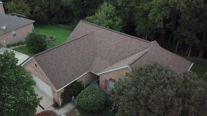 Brown asphalt shingle roof on a family house