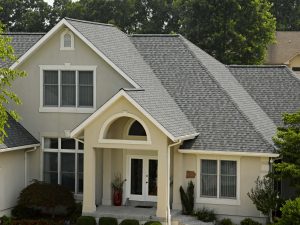 Beautiful pewter-colored asphalt shingles on a large home
