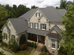 View of a gorgeous home with a brand new gray roof