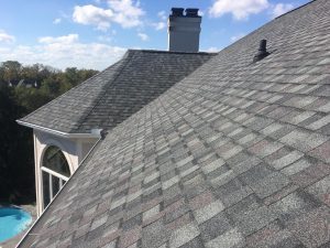 Close-up view of gorgeous gray asphalt shingles on a roof